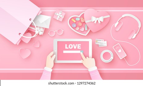 Women are searching for Love on tablet in Valentine's day with decorated items and accessories in pink set on desk. Desk design of Love. paper cut and craft style. vector, illustration.