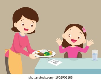 
Women serving food to girl ,Mother served food to her daughter ,The family enjoy cooking.