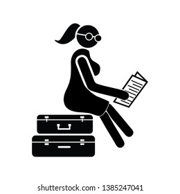 Women sit on the luggage