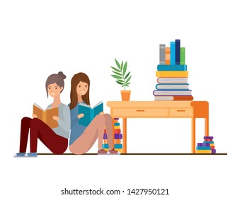 women sitting with book in hands