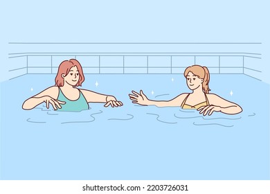 Women in swimsuits have fun in swimming pool together. Female friends in bikini swim in water in indoor pool. Hobby and recreation. Vector illustration. 