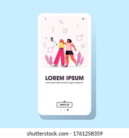 women taking selfie photo on smartphone camera girls in casual trendy clothes female cartoon characters standing together smartphone screen copy space full length vector illustration