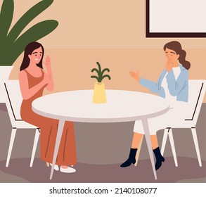 women talking at table in the restaurant