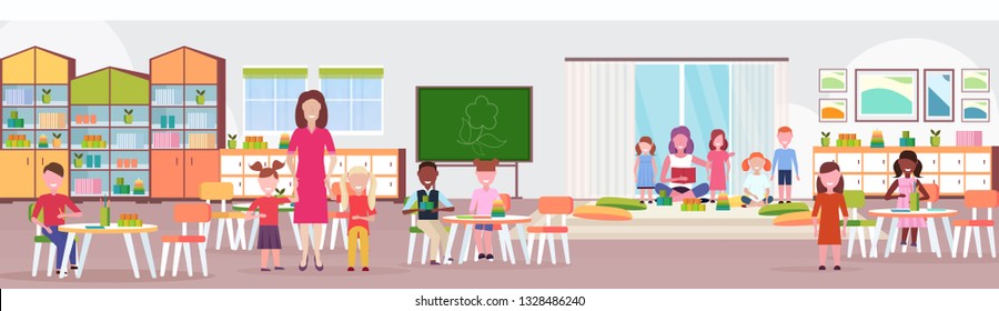 women teachers teaching mix race boys and girls preschool modern kindergarten children classroom with chalkboard desks chairs playground kid room interior full length flat horizontal