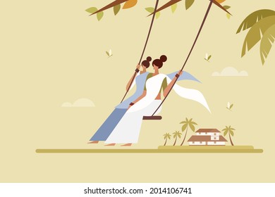 Women wearing traditional dress swinging in outdoor. Concept for Onam festival of Kerala, India