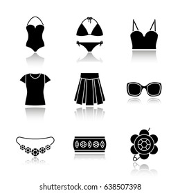 Women's accessories drop shadow black icons set. Clothes and jewelry. Swimsuits, top, t-shirt, skirt, sunglasses, bracelet, brooch, necklace. Isolated vector illustrations