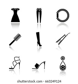 Women's accessories drop shadow black glyph icons set. Sun frock, skinny jeans, hair scrunchy, straightener and brush, high heel boot and shoes, earring. Isolated vector illustrations