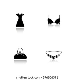 Women's clothes and accessories. Drop shadow black icons set. Sun frock, brassiere, necklace, purse. Isolated vector illustrations
