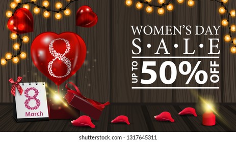 Women's day discount horizontal modern banner on wood background with garland, gift and balloon