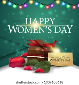 Women's day green greeting card with candy and rose