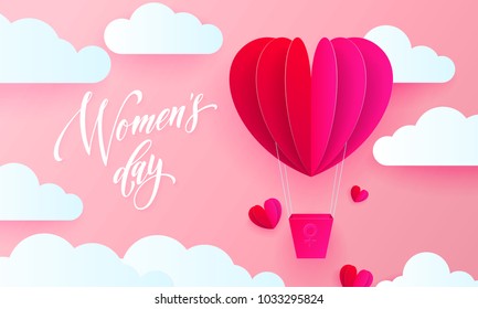 Women's day text on pink paper art heart balloon with gift box on white cloud pattern background. Vector 8 March greeting card for mother's day. Papercut heart icon with gold bead chaplet. Internation