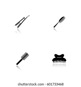 Women's hair accessories. Drop shadow black icons set. Hairbrushes, straightener, claw hair clip. Isolated vector illustrations