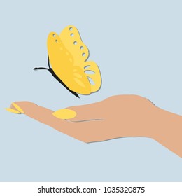 women's hand holding a butterfly