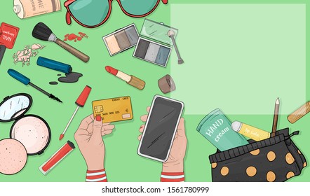 Women's hands using a credit card and a smartphone to pay for purchases on the Internet. Cosmetics, beauty and health products. The view from the top. Mock up. Template.