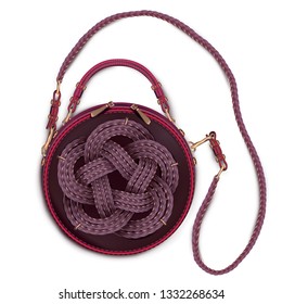 Women's round leather bag with a long handle decorated with a three strand cord. Vector illustration. Top view.