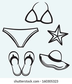 Women's swimsuit, hat, flip-flops and starfish isolated on blue background