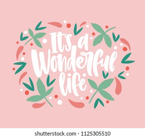 It's a Wonderful Life inscription written with cursive calligraphic font and decorated by leaves and berries. Beautiful phrase or slogan handwritten on pink background. Vector illustration for print.