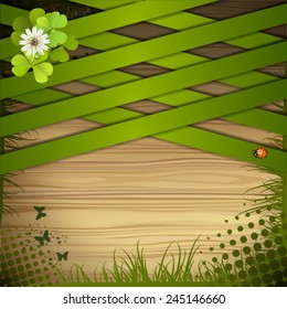 Wood background with clover and green strips