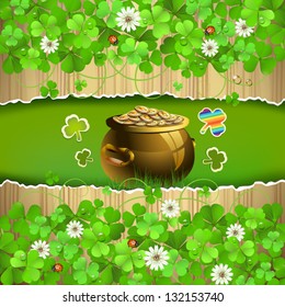 Wood background with clover and pot with coins