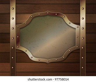 Wood background with metallic plate