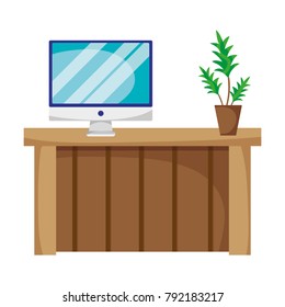 wood desk with computer screen and plant