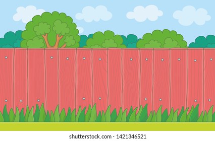 Wood Fence on the backyard. Grass Lawn and Red Wooden Fence