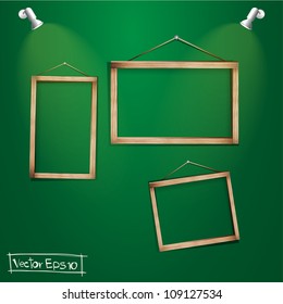 Wood frames on the green wall