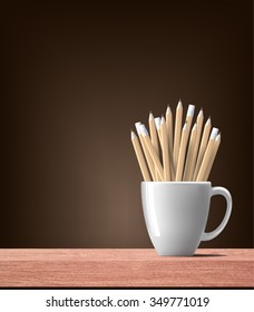 wood pencils in white cup on wooden table and brown shaded color background