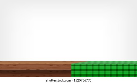 wood plank and green tablecloth front view for copy space, empty table top and tablecloth, green checkered cloth on wood plank for background, tablecloth on tabletop, fabric on wooden table grey wall