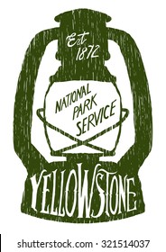 Woodcut-style vintage-looking label in the shape of a lantern with hand lettering that says Yellowstone.