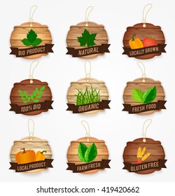 Wooden agriculture badges  and  labels, isolated on white background. Organic, bio, natural, fresh food product, locally grown, gluten free,farm fresh. Vector illustration.