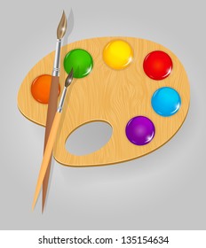 Wooden art palette with paints and brushe