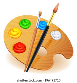 Wooden art palette with paints and brushes.