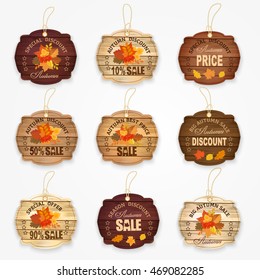 Wooden autumn sale labels and badges collection with autumn leaves - best price, big autumn sale, special offer, discount. Vector illustration.