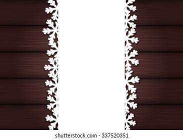 Wooden background with empty frame and snowflakes for Christmas
