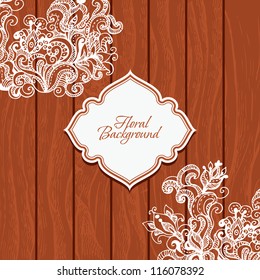 Wooden background with flowers and frame