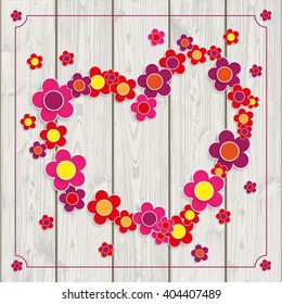 Wooden background with flowers, heart shape and vintage frame.  Eps 10 vector file.