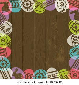 wooden background with frame of easter eggs, vector