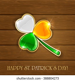 Wooden background with leaf clover in Irish flag colors, theme of Happy St. Patrick's Day, illustration.