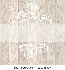 Wooden background with place for text. Floral pattern.