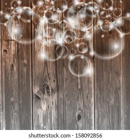 wooden background and transparent bubbles
