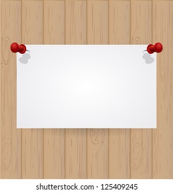 Wooden background with white note paper