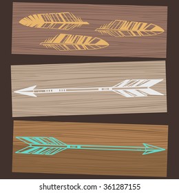 Wooden banners with arrows and feathers. Vector hand drawn illustration