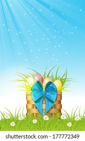 wooden basket with easter eggs on fresh grass