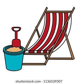 wooden beach chair and sand bucket