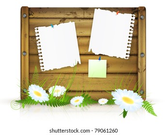 wooden board for messages with grass and flowers over white background