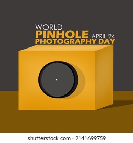 A wooden box with a lens that has a pinhole for taking pictures with bold texts, World Pinhole Photography Day April 24