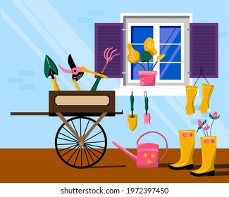 Wooden cart or wheelbarrow with gardening instruments.Facade of village house,window with shutters.Planting tools in cartoon style.Eco hobby.Grow and cultivate flowers.Countryside. Vector illustration