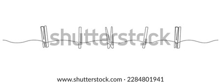 Wooden clothespin in one continuous line drawing. Clothesline with pin and peg different forms for photo album and laundry web design concept in simple linear style. Editable stroke. Doodle vector Foto stock © 