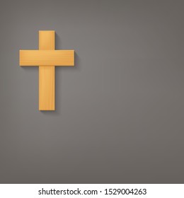 wooden cross with shadow on grey